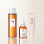a group of bottles and a tube of cream