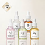 a group of bottles with different colored liquid
