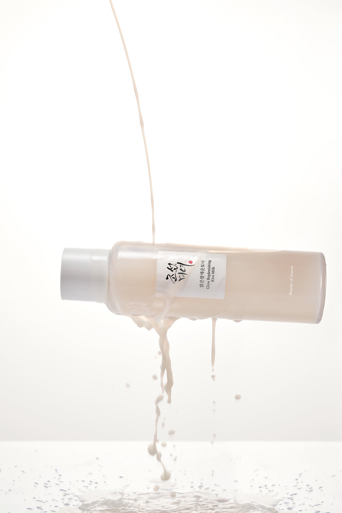 a bottle of liquid pouring out of it
