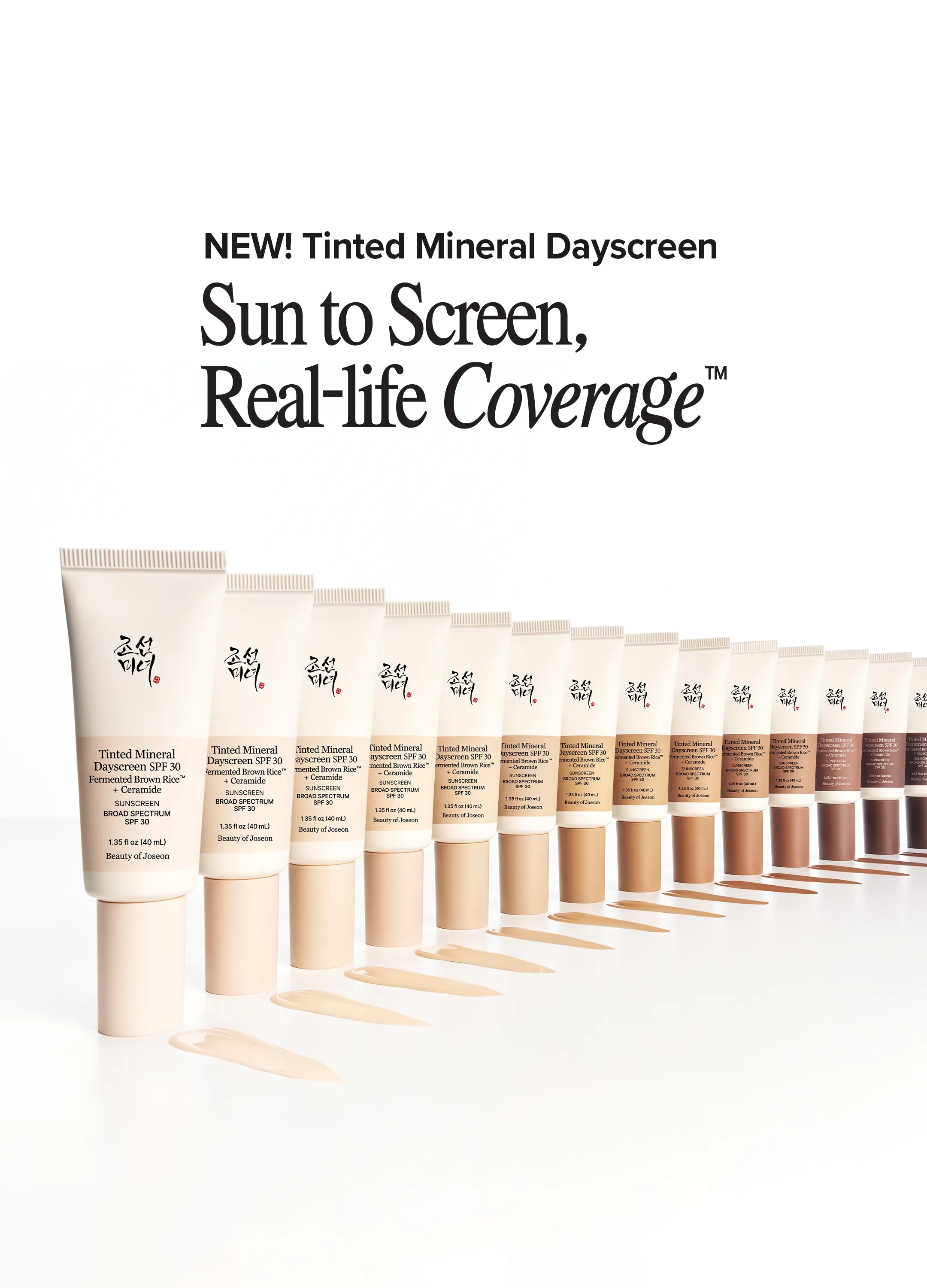 A row of tinted mineral sunscreen tubes in a gradient of skin-tone shades, with beige swatches spread in front of each tube on a white background. Text at the top reads 'NEW! Tinted Mineral Dayscreen Sun to Screen, Real-life Coverage'.